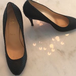 Christian Louboutin snake skin pumps